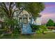 Two story home with large front porch and landscaped yard at 4233 Haulover Dr, Johns Island, SC 29455