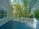 Private deck offering tranquil views of the backyard and surrounding trees at 4233 Haulover Dr, Johns Island, SC 29455