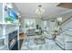 Spacious living room with fireplace, large windows and comfortable seating at 4233 Haulover Dr, Johns Island, SC 29455
