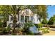Two-story house with a front porch and lush landscaping at 4233 Haulover Dr, Johns Island, SC 29455