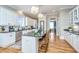 Modern kitchen with white cabinets, granite island, and stainless steel appliances at 4233 Haulover Dr, Johns Island, SC 29455