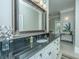 Bathroom features a large vanity with granite countertops and an ornate mirror at 4233 Haulover Dr, Johns Island, SC 29455