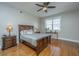 Spacious bedroom with hardwood floors, ceiling fan and large window at 4233 Haulover Dr, Johns Island, SC 29455