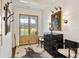 Bright and spacious entryway with zebra rug and antique furniture at 4285 Clover Hill Rd, Green Pond, SC 29446