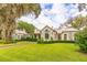 Charming two-story home with a metal roof and landscaped yard at 4285 Clover Hill Rd, Green Pond, SC 29446