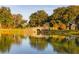 Stone bridge reflecting in a pond surrounded by trees at 4285 Clover Hill Rd, Green Pond, SC 29446