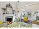 Living room boasts a white fireplace, striped rug, and green accents at 4285 Clover Hill Rd, Green Pond, SC 29446