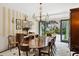 Formal dining room with a large table, chandelier, and access to garden at 4285 Clover Hill Rd, Green Pond, SC 29446