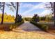 Long paved driveway leading to gated entrance at 4285 Clover Hill Rd, Green Pond, SC 29446