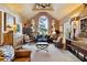 Spacious living room with vaulted ceiling, large windows, and eclectic decor at 4285 Clover Hill Rd, Green Pond, SC 29446