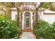 Pergola covered walkway leading to a white cottage at 4285 Clover Hill Rd, Green Pond, SC 29446