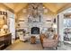 Spacious living room features a brick fireplace, comfortable seating, and unique decor at 4285 Clover Hill Rd, Green Pond, SC 29446