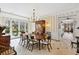 Elegant dining room features a large table, chandelier, and access to the backyard at 4285 Clover Hill Rd, Green Pond, SC 29446