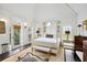Main bedroom with white canopy bed, fireplace, and access to a patio at 4285 Clover Hill Rd, Green Pond, SC 29446