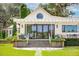 White house with a pergola, brick steps, and landscaping at 4285 Clover Hill Rd, Green Pond, SC 29446