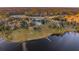 Aerial view of home nestled on a lakeside property with natural beauty at 4285 Clover Hill Rd, Green Pond, SC 29446