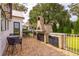 Outdoor kitchen and dining area on brick patio at 4285 Clover Hill Rd, Green Pond, SC 29446