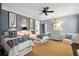 Twin bedroom with blue and white bedding, and ceiling fan at 4285 Clover Hill Rd, Green Pond, SC 29446