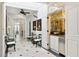 Elegant hallway with white shiplap walls, a tiled floor, and built-in bar at 4285 Clover Hill Rd, Green Pond, SC 29446
