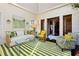 Relaxing living room features a green striped rug and white sofa at 4285 Clover Hill Rd, Green Pond, SC 29446