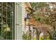 Exterior detail of the house, showcasing a lantern and window with shutters at 4285 Clover Hill Rd, Green Pond, SC 29446