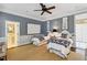 Twin bedroom with blue and white bedding, and access to a bathroom at 4285 Clover Hill Rd, Green Pond, SC 29446