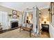 Charming bedroom with four-poster bed and fireplace at 4285 Clover Hill Rd, Green Pond, SC 29446