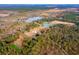Aerial view of property showing home and pond at 4285 Clover Hill Rd, Green Pond, SC 29446