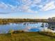 Serene lake view with fall foliage reflecting on the water at 4285 Clover Hill Rd, Green Pond, SC 29446