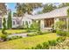 Charming home with landscaped yard, metal roof, and lush greenery at 4285 Clover Hill Rd, Green Pond, SC 29446
