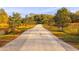 Gravel driveway through a landscape of trees at 4285 Clover Hill Rd, Green Pond, SC 29446