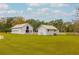 Two white farm buildings in a field with white post and rail fencing at 4285 Clover Hill Rd, Green Pond, SC 29446