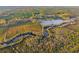 Aerial view of the property, featuring a pond and forest at 4285 Clover Hill Rd, Green Pond, SC 29446