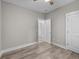 Spacious bedroom with wood-look floors and access to hallway at 168 Aleene Dr, Summerville, SC 29485