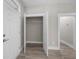 Open concept entry closet with wire shelving and wood-look flooring at 168 Aleene Dr, Summerville, SC 29485