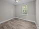 Spacious bedroom with hardwood floors and large window at 168 Aleene Dr, Summerville, SC 29485
