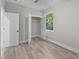 Bedroom with walk-in closet and window, featuring wood-look floors at 168 Aleene Dr, Summerville, SC 29485