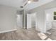 Bedroom with en-suite bathroom and walk-in closet, featuring wood-look floors at 168 Aleene Dr, Summerville, SC 29485