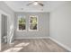 Bedroom with two windows, wood-look floors and en-suite bathroom at 168 Aleene Dr, Summerville, SC 29485