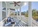 Inviting front porch with seating area, overlooking a tree-lined street at 2600 Josiah St, Charleston, SC 29492