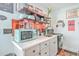 Charming kitchen with white cabinets and copper backsplash at 2600 Josiah St, Charleston, SC 29492