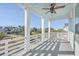 Covered porch with white railings, offering views of the neighborhood at 2600 Josiah St, Charleston, SC 29492