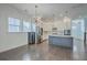 Open dining area with hardwood floors and a chandelier at 2600 Josiah St, Charleston, SC 29492