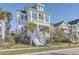 Two-story house with front porch and palm trees at 2600 Josiah St, Charleston, SC 29492