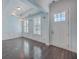 Bright entryway with hardwood floors and white wainscoting at 2600 Josiah St, Charleston, SC 29492