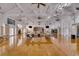 Spacious meeting room featuring hardwood floors and a stage area at 1735 Atlantic Ave, Sullivans Island, SC 29482