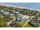 Aerial view showcasing a house, pool, and oceanfront community at 1735 Atlantic Ave, Sullivans Island, SC 29482