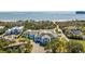 Aerial view of a waterfront property with a main house, pool, and ocean views at 1735 Atlantic Ave, Sullivans Island, SC 29482