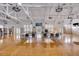 Large meeting room with hardwood floors, high ceilings, and white exposed beams at 1735 Atlantic Ave, Sullivans Island, SC 29482