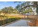Private deck overlooking fenced backyard and tranquil marsh views at 1894 Capri Dr, Charleston, SC 29407